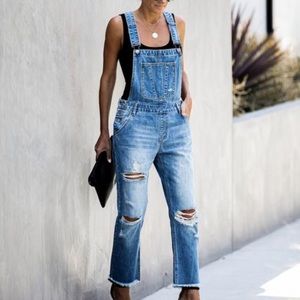 Distressed denim overalls